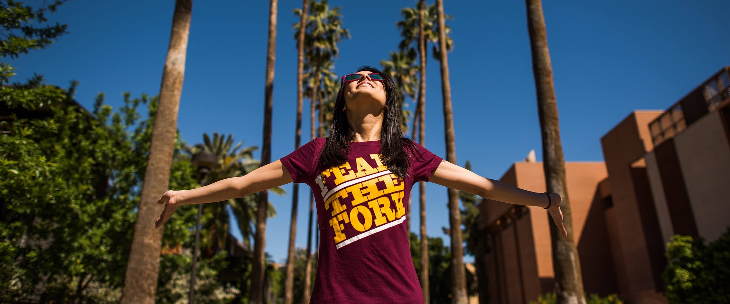 girl standing on asu palm walk