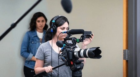 Student with a camera