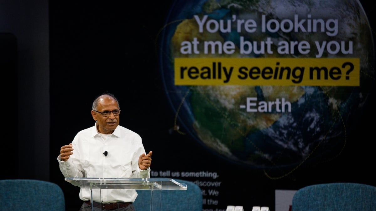 Person at a podium discussing water on earth