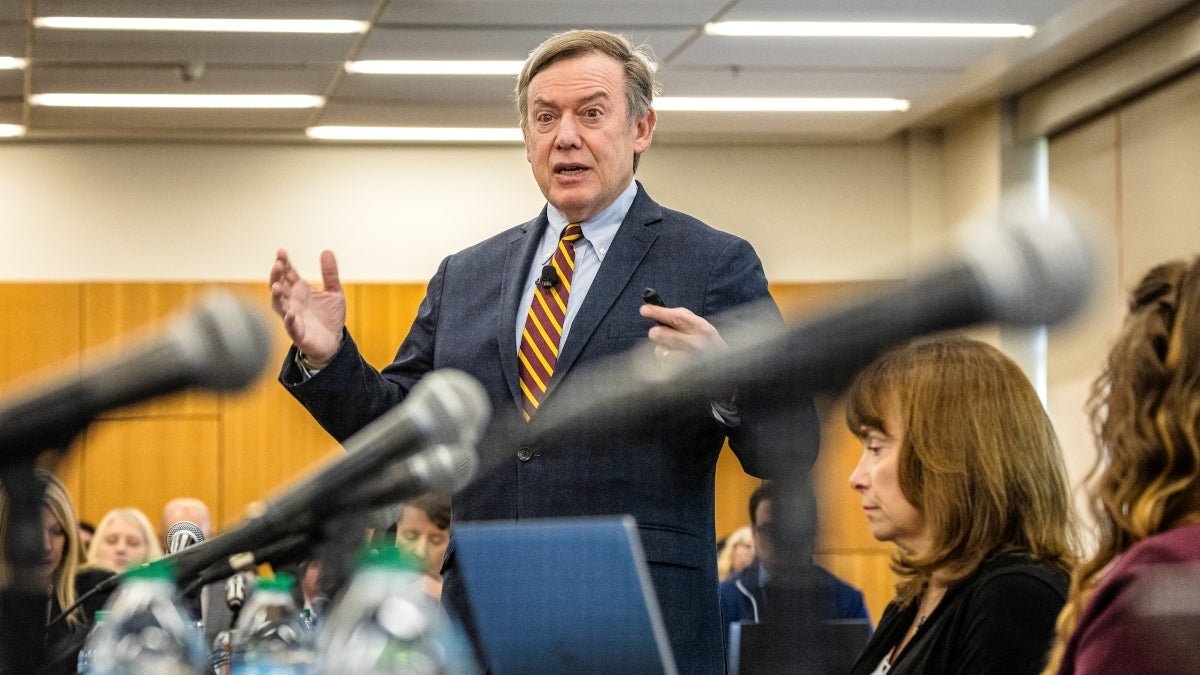 ASU President Michael Crow speaks in front of a room of people.